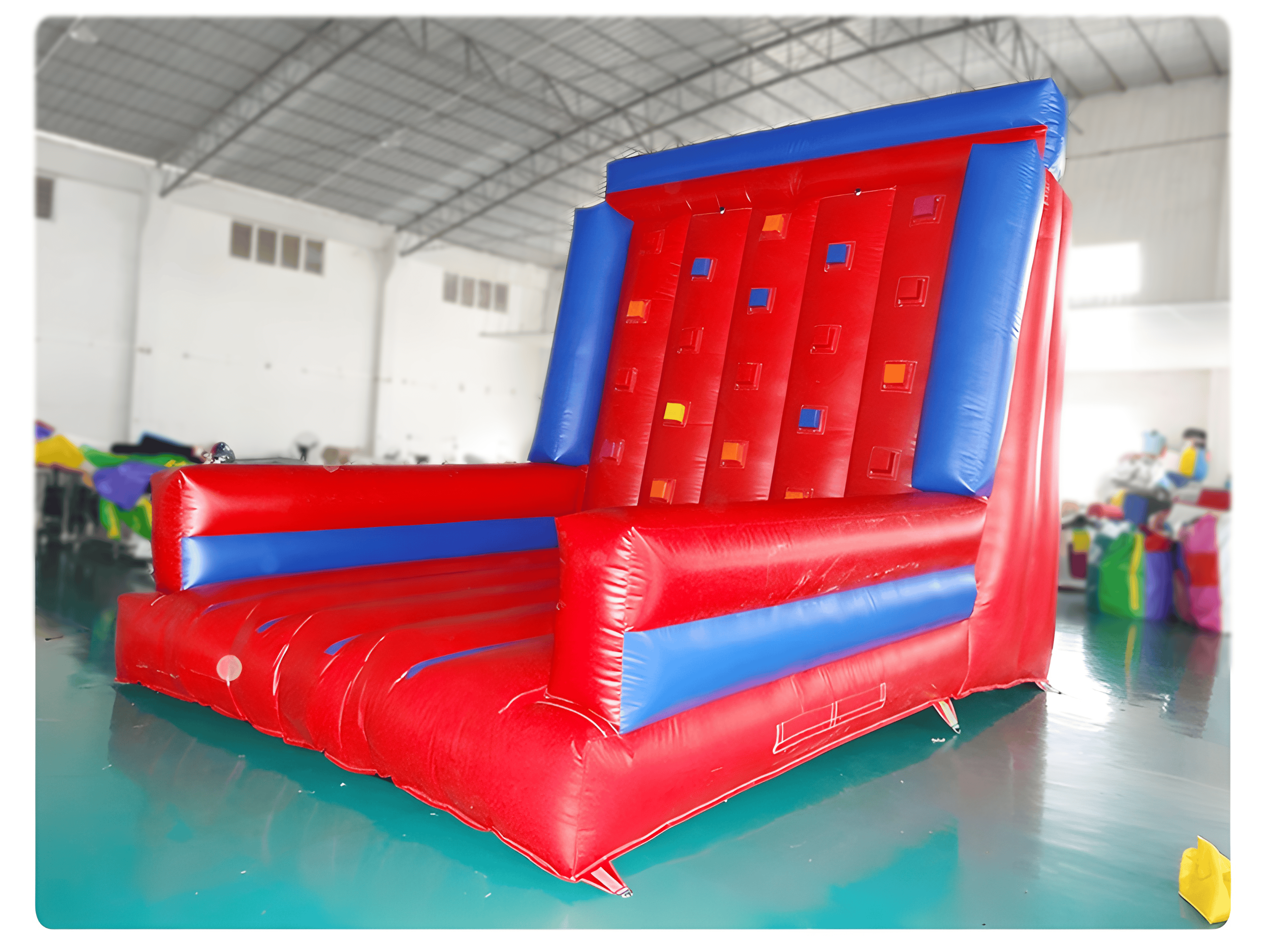 Red and blue inflatable climbing wall by Soft Summits with a simple design, perfect for easy set-up and indoor or outdoor use.