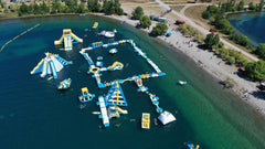 Soft Summits commercial inflatable water park with slides and splash areas, designed for outdoor fun and large-scale water activities.
