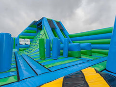 Soft Summit's First Generation Obstacle Course with colorful climbing elements and tunnels for kids' outdoor play and active fun.