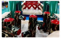 Close-up of Soft Summits commercial inflatable obstacle course in camouflage with colorful inflatable obstacles and rugged design.