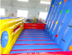 Side view of Soft Summits' inflatable climbing wall and outdoor playground, showcasing its sturdy design and exciting play areas for outdoor events.