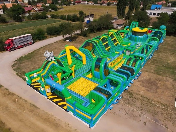 Soft Summits 4th Generation Bounce House obstacle course with colorful tunnels and slides for active outdoor fun.