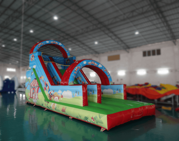 Front view of Soft Summits commercial size PVC inflatable water slide with colorful slides and climbing areas.