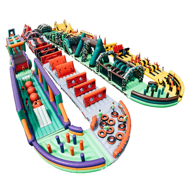 Large white inflatable obstacle course by Soft Summits designed for commercial use, featuring multiple climbing and sliding sections.