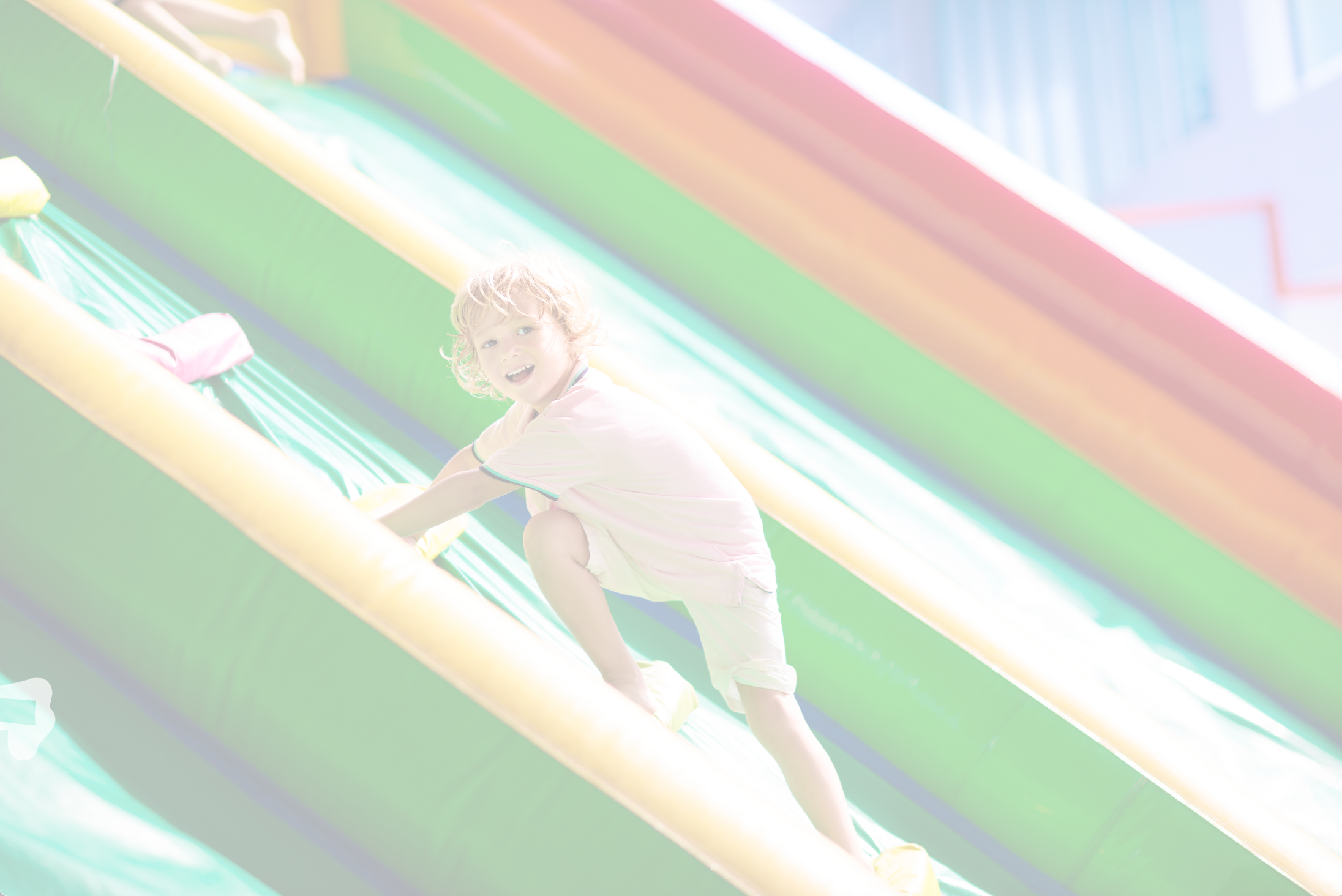 A young adventurer climbing a Soft Summits inflatable, showcasing fun and active play for kids of all ages.