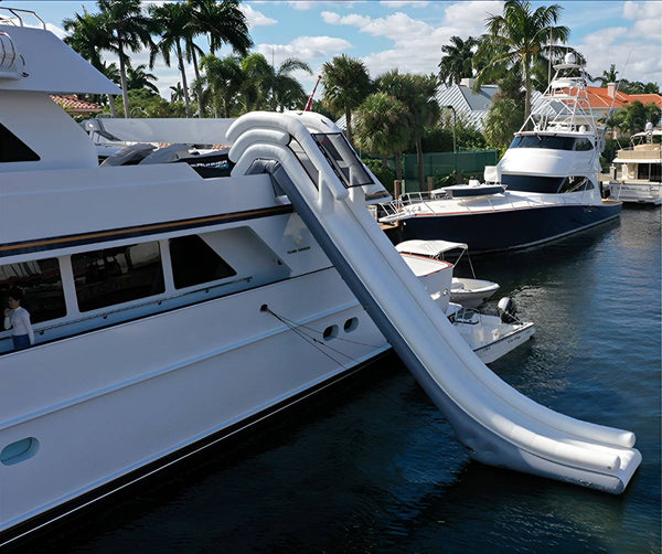 Large inflatable water slide by Soft Summits designed for boats, featuring a dock slide for easy access and fun on the water.
